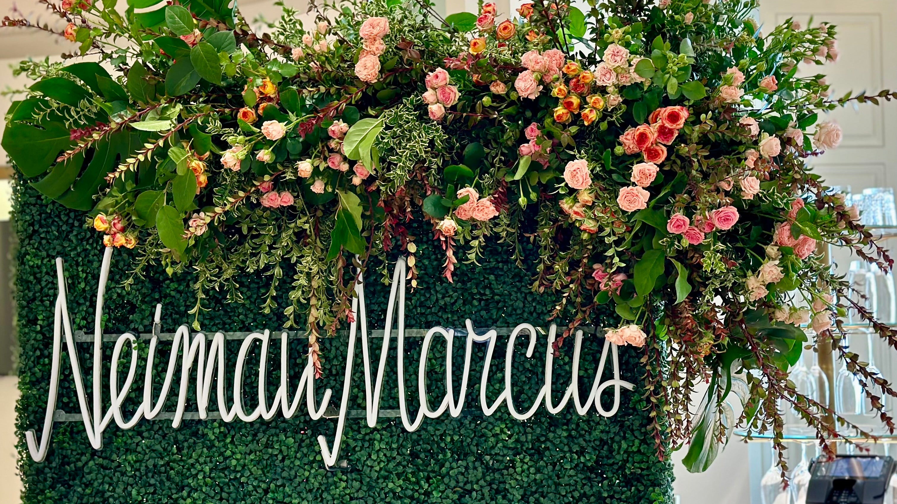 flower wall with brand sign for Neiman Marcus San Francisco 