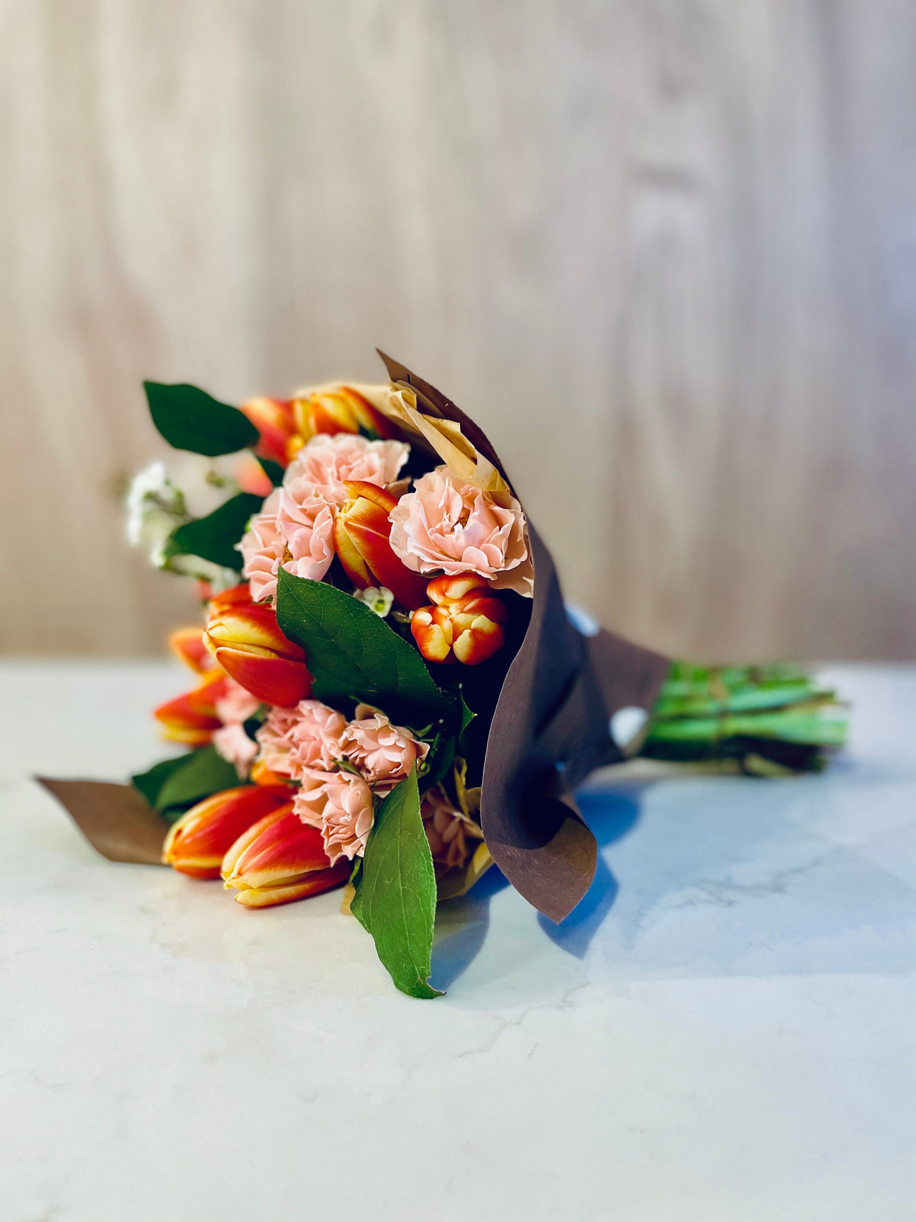 HAND-WRAPPED BOUQUET ACME FLORAL CO.