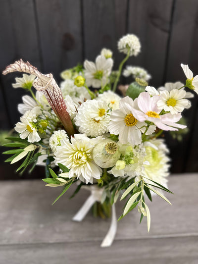 real florist doing floristry for real people who want artsy weird floral for wedding sand parties