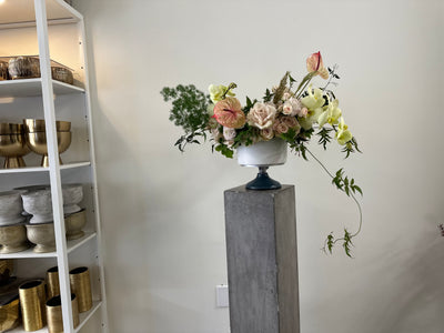 orchids, roses, anthurium, jasmine, thistle arranged loose with lots of movement