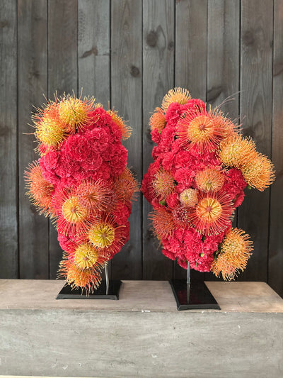 colorful flower sculptural with no vase.