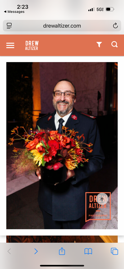 here we have a lucky attendee of the gala taking home a floral centerpiece after the event. 