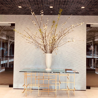 luxurious blooming branches by acme floral co