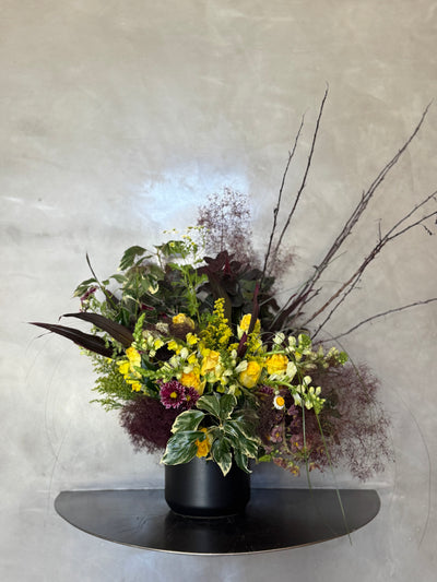 modern lobby floral arrangements with smokebush and other crazy wonderful yellows and burgundy.