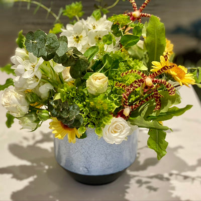 hydrangea, dubnium, orchids, roses, mums in whites and yellows