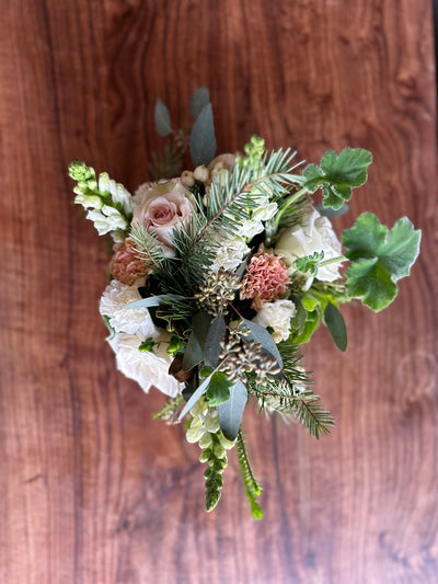 a thoughtful sensitive floral arrangment in soft pinks and white and wonderful greenery. relax with it