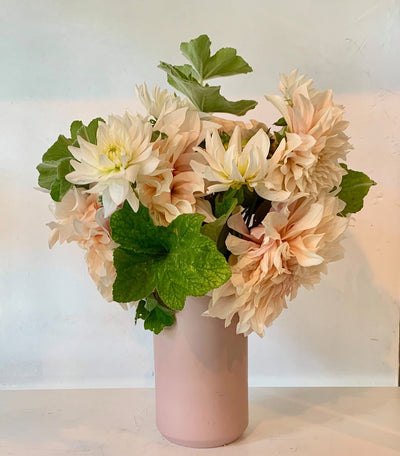 Locally grown dahlias arranged in a pink vase