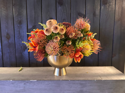 tulips, mums, pin cushions arranged low and 